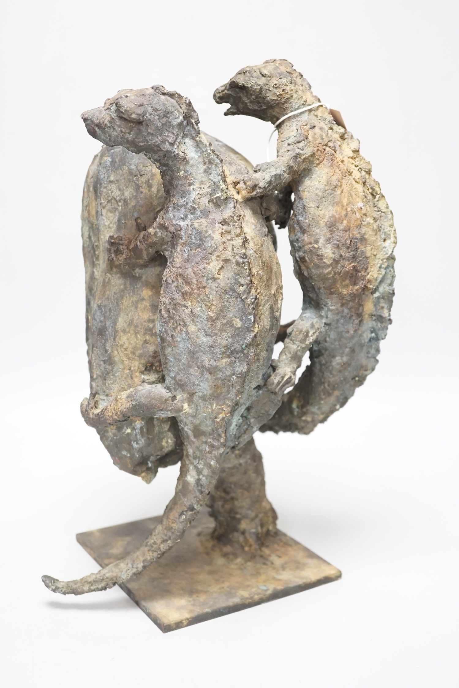 A patinated bronze, two lizards scaling a rock, raised on a square base, monogrammed SMV and dated 1992 to the base, 40cm high